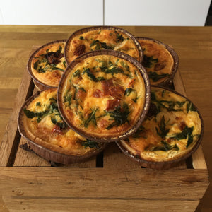 Goats cheese, confit, and wild rocket quiche